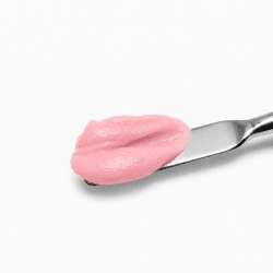 Acrygel Dusty Cover covering pink acrygel on a spatula