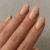 Créme de la Créme Gel Polish in a soft and creamy beige shade without shimmer. Perfect for a subtle and elegant look.