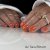 Nemo Gel Polish from Nail Systems in a bright and vibrant orange shade that gives the nails an energetic and playful look.