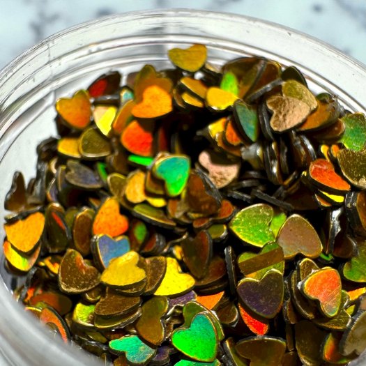 Glitter Heart Gold – Thin, gold shimmering hearts to add an elegant and playful touch to nail designs.