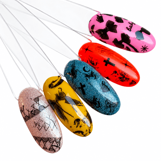 Nail art with Bow Affair Foil Box, black bows, crosses, butterflies and lace on five coloured tips