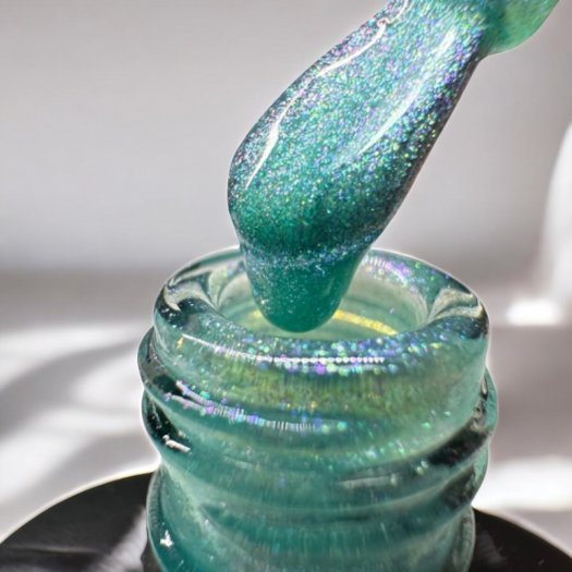 Nail Systems Fairy Mermaid gel polish – a turquoise glitter color with a magical shine effect reminiscent of a mermaid's fin.