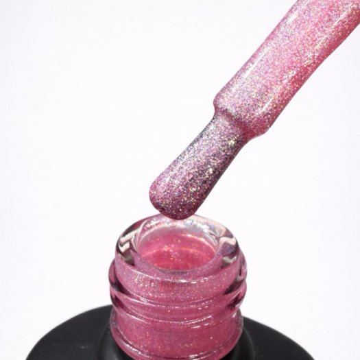 Pink glitter gel polish with extreme shine that creates a magical and eye-catching effect on the nails.