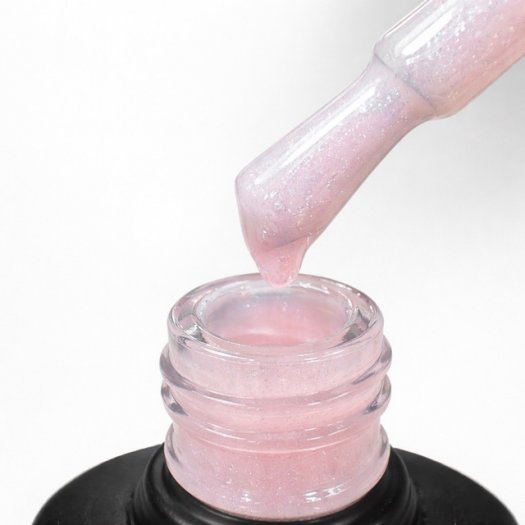 Liquid Extension Glowcrush is a milky pink-white builder gel with silver micro-glitter – like crushed diamonds. Strong, self-lev
