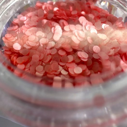 Pärlskimrande paljetter i 1 mm storlek. Set med 12 olika färger för eleganta och kreativa nageldesigner.