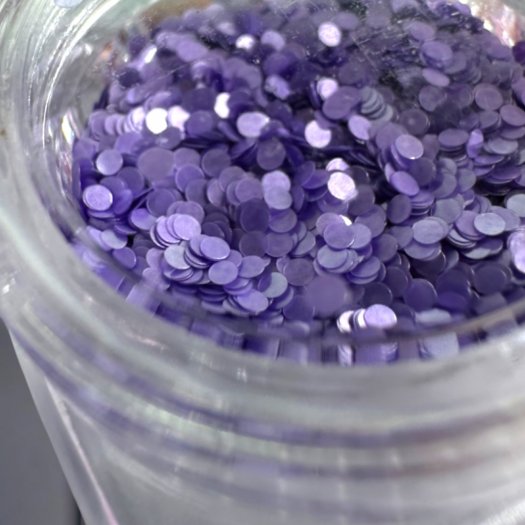 Pärlskimrande paljetter i 1 mm storlek. Set med 12 olika färger för eleganta och kreativa nageldesigner.