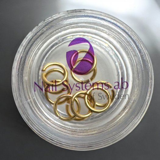 10 gold-colored Nail Rings in 6 mm size - perfect for decorating nails after piercing with Piercing Bit. Delivered in pr
