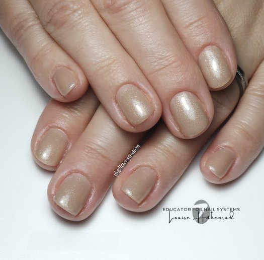 Discover Nude Sparkle Gel Polish in a warm beige shade with elegant shimmer. Perfect for a sophisticated look suitable for any o