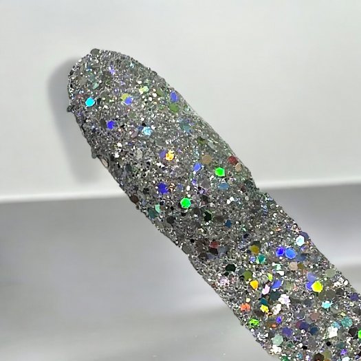 Glit-Mix Holo Silver Storm is a silver glitter with a holographic effect in mixed sizes. 5g jar. Used in sticky gel, capsules