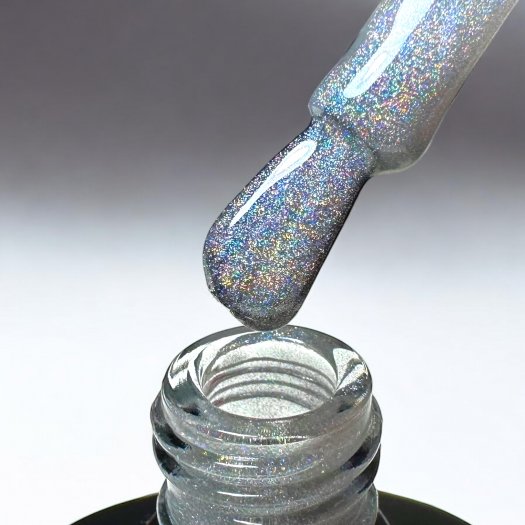 Rainbow Cat Eye Top är ett glansigt top coat med holografisk regnbågseffekt som aktiveras med magnet. Non-wipe finish och krista