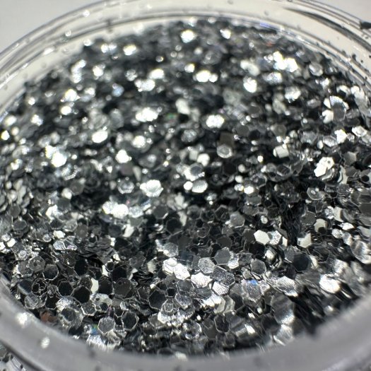 Glit-Mix Pure Silver is a pure silver glitter in mixed sizes. 5g jar. Use in sticky gel, encapsulate or sprinkle over T
