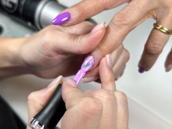 Gel polish applied to a nail during the manicurist training